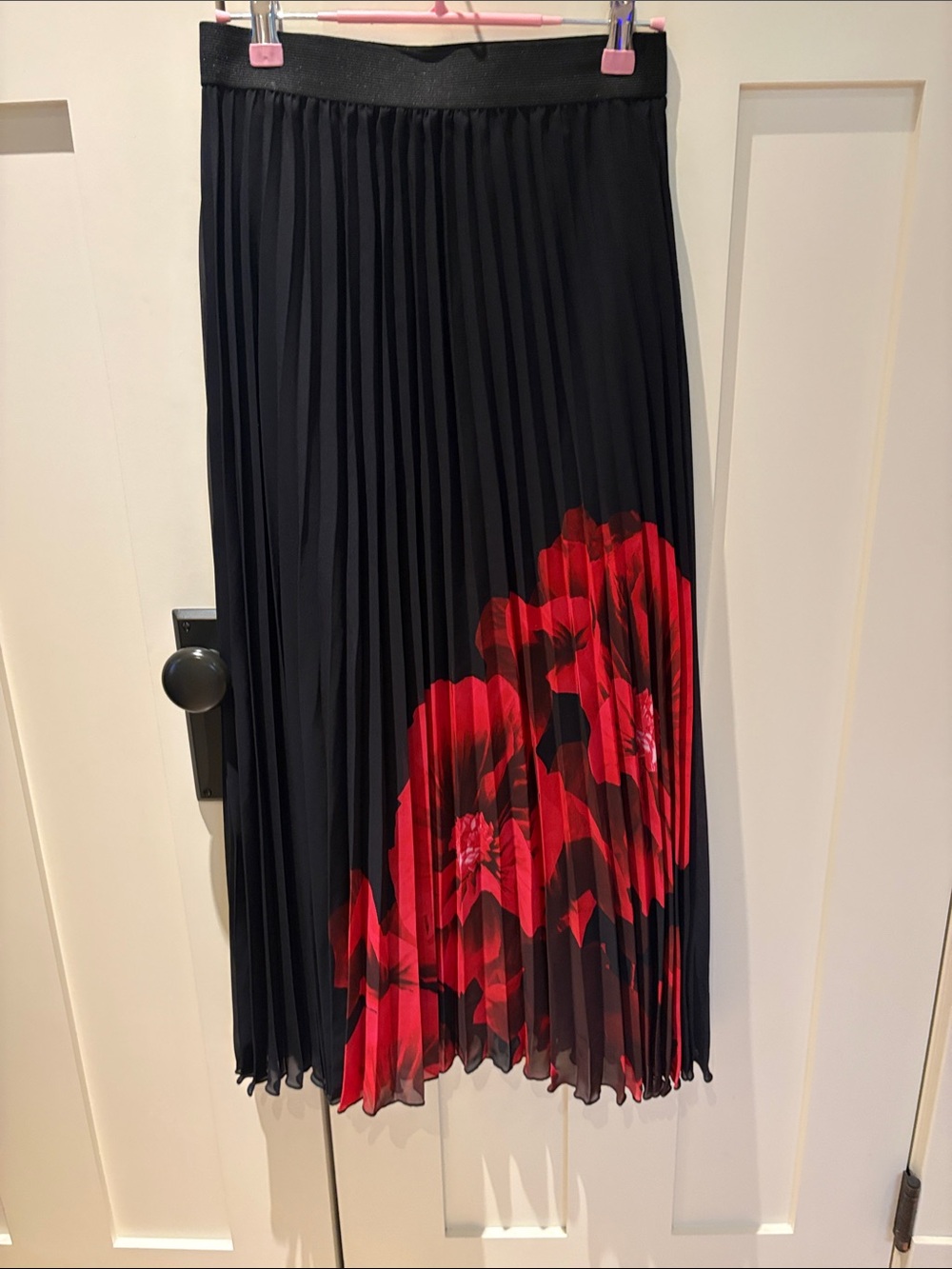 Black Pleated Midi Skirt with Red Floral Accent